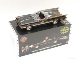 A modern diecast 'Batmobile' by Jada Toys, boxed with Batman & Robin figures, circa 2019, in