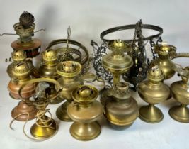 A collection of sixteen various brass and copper oil lamps, circa early 20th century and later,