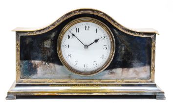 A 1920s French silver plated mantel clock, having enamelled dial with Roman numerals, the 8 day