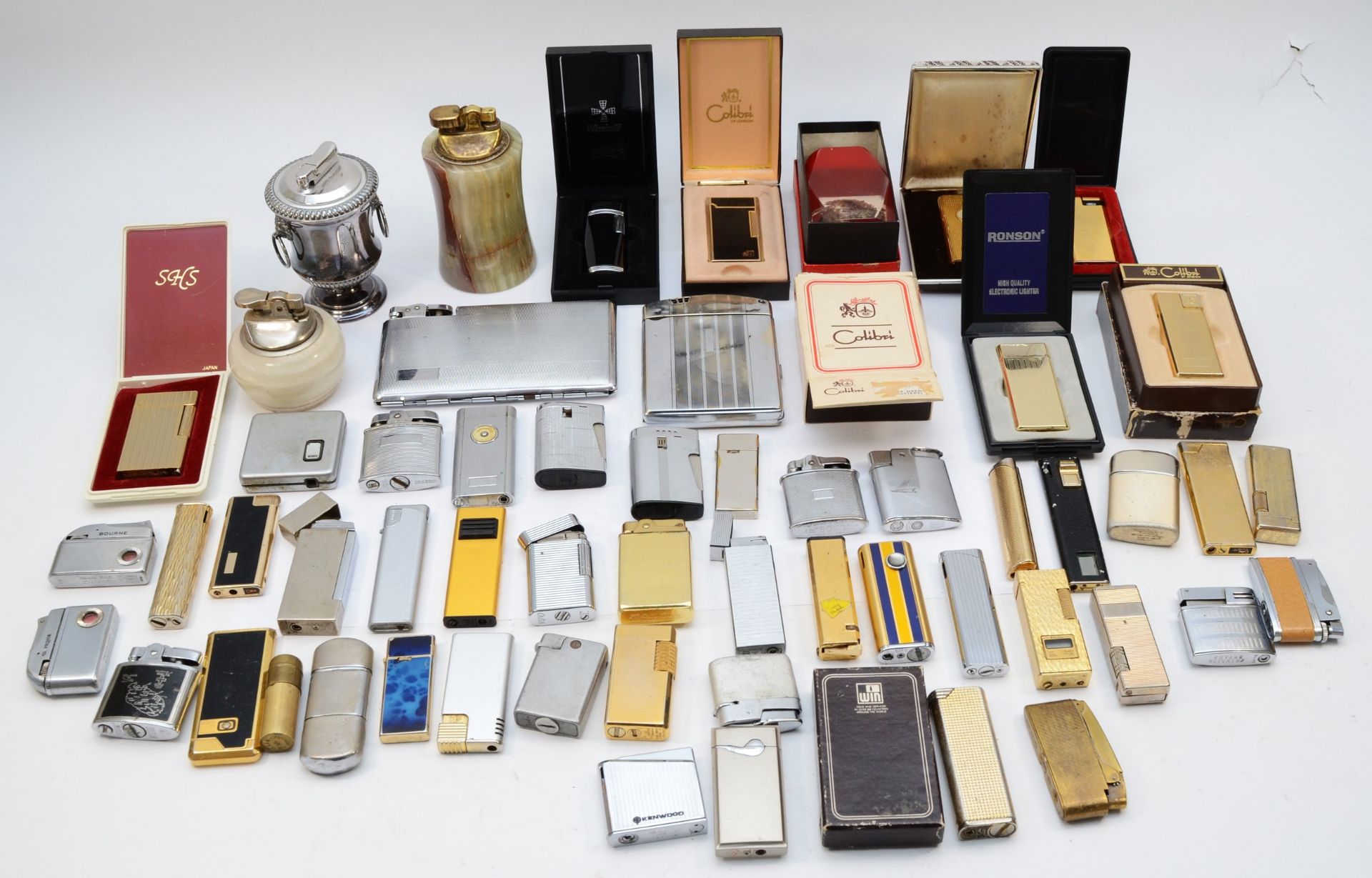 A collection of mid 20th century and later cigarette lighters, pocket and table, gas and petrol