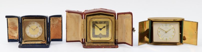 A mid 20th century Junghans traveling alarm clock, having manual wind movement, 6.5cm tall, together