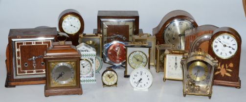 A collection of early 20th century and later clocks, to include mantel, carriage, traveling alarm