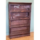 A Globe Wernicke Co Ltd oak freestanding four sectional library bookcase, enclosed by a