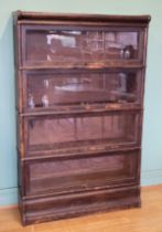 A Globe Wernicke Co Ltd oak freestanding four sectional library bookcase, enclosed by a