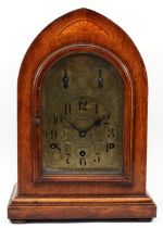 A late 19th century German mahogany bracket clock, the 5" chased brass arched dial stamped
