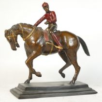 A 20th Century cold painted spelter model of a Jokey on horse, 32cm tall.
