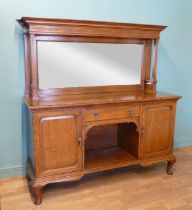 An Edwardian oak mirror back sideboard, the blind fretwork frieze with geometric pattern with mirror