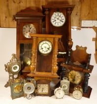 A collection of early 20th century and later clocks to include mantel clocks and Vienna style wall