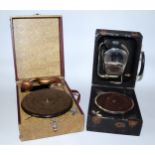 A Decca portable wind up gramophone No 22, together with a unnamed portable wind up gramophone,