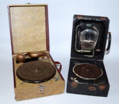 A Decca portable wind up gramophone No 22, together with a unnamed portable wind up gramophone,
