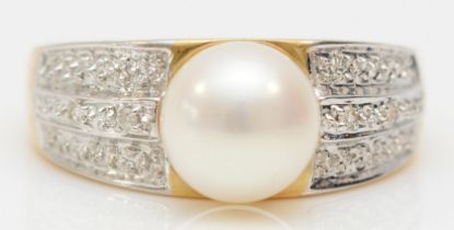 A 14ct gold and 8mm cultured pearl dress ring, the shoulders set with two diamonds, N, 3.5gm
