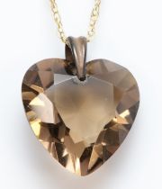 A heart cut smokey quartz on 375 gold chain, 20 x 17mm, 3.7gm.