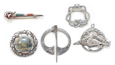 A Scottish silver and agate Dirk brooch, 50mm, and four other Celtic brooches