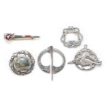 A Scottish silver and agate Dirk brooch, 50mm, and four other Celtic brooches