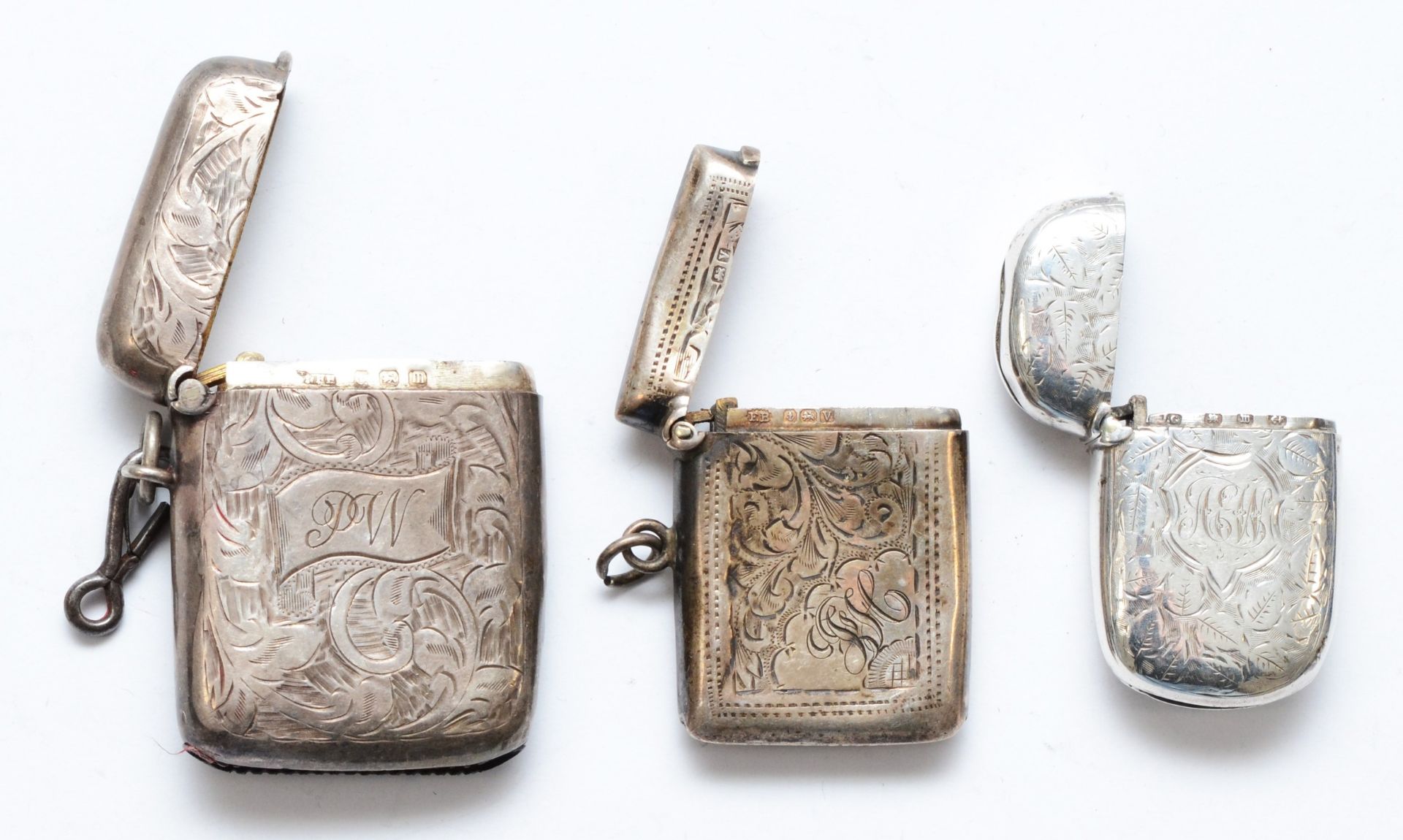 Three silver vesta cases, Birmingham 1896, 1911 and 1920, 58gms. - Image 3 of 3