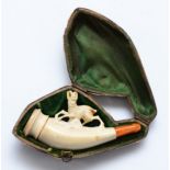 A carved meerschaum pipe, in the form of a ram, 8cm, case