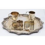 Two silver christening mugs, two silver napkin rings, 173gms, together with an electroplated