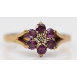 A vintage 9ct gold ruby and diamond cluster ring, O 1/2, 2.2gm