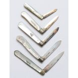 A Victorian silver and mother of pearl fruit knife, Sheffield 1881 and four other later examples.