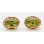 A 9ct gold pair of peridot ear studs, 1gm