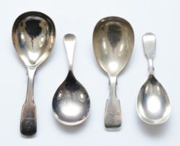 A George III silver fiddle pattern caddy spoon, London 18811, two Victorian examples, London 1845
