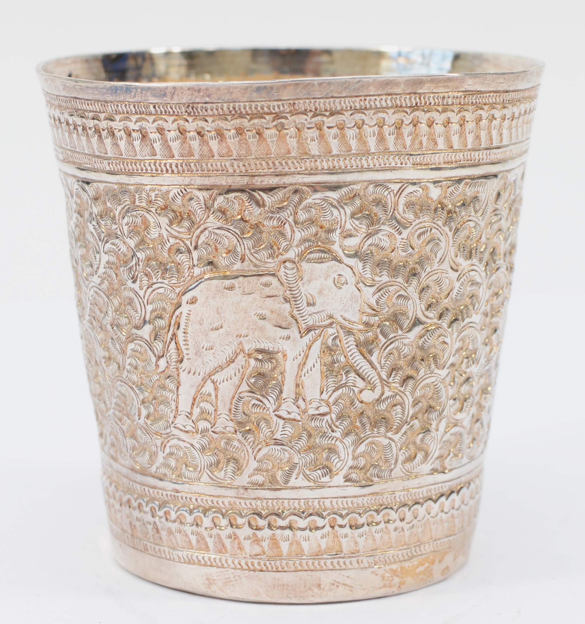 An Indian silver beaker, stamped 925, with embossed and chased elephant decoration, 8cm, 74gms