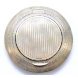 An Art Deco silver and black enamel compact, London import 1922, lacking interior, diameter 8.5cm,