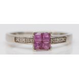 A 9ct white gold four Princess cut pink sapphire ring, diamond set shoulders, P, 1.8gm