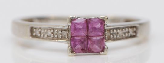 A 9ct white gold four Princess cut pink sapphire ring, diamond set shoulders, P, 1.8gm