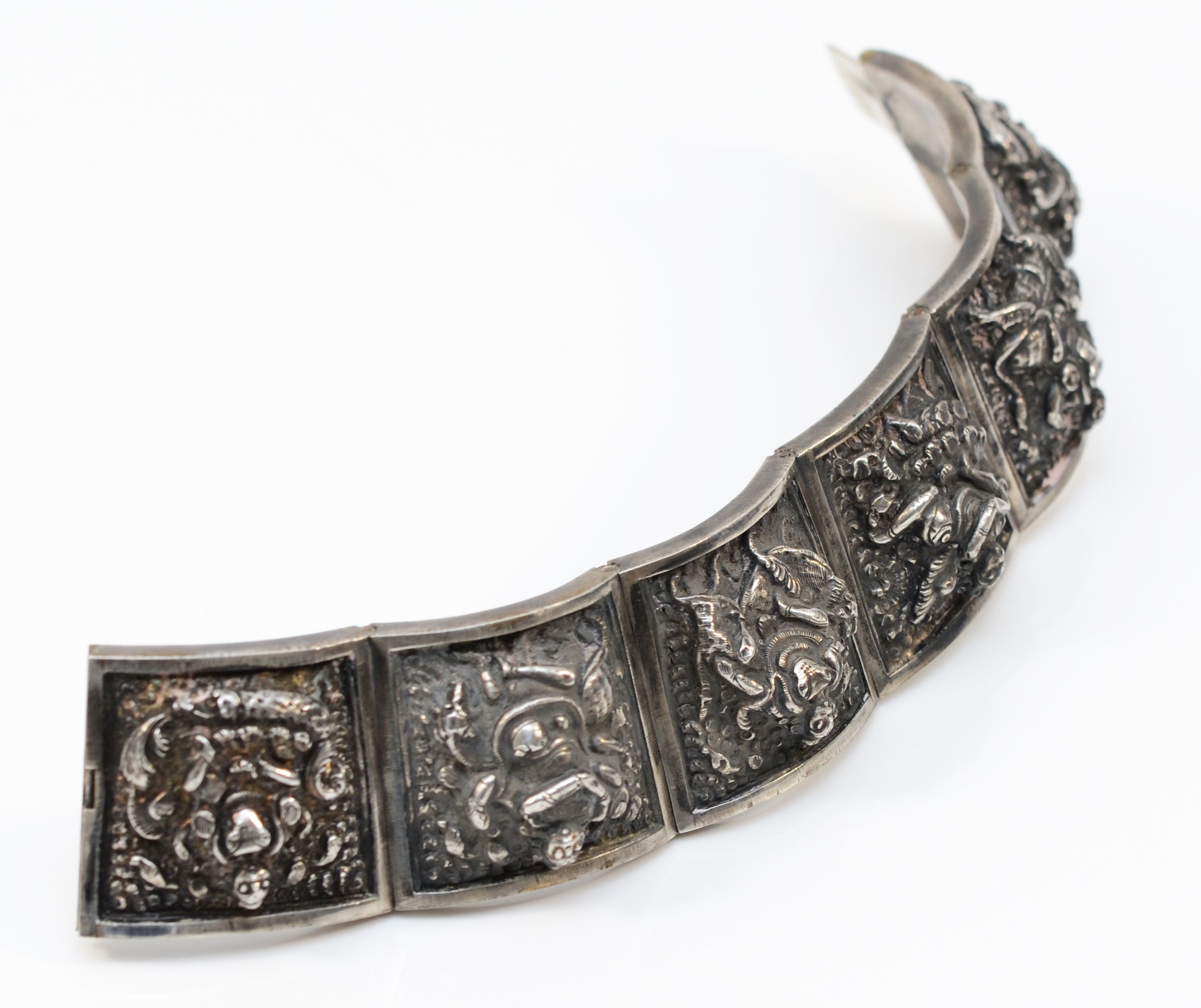 An Indian silver cuff hinged braclet, six embossed panels with Deities, 63 x 48mm, 67gm - Image 4 of 5