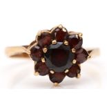 A 9ct gold and garnet cluster ring, Q, 2.5gm