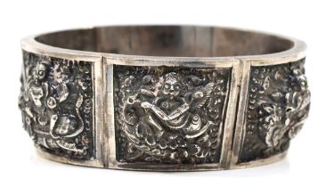 An Indian silver cuff hinged braclet, six embossed panels with Deities, 63 x 48mm, 67gm