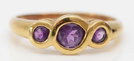 A 9ct gold three stone amethyst ring, Q, 2gm