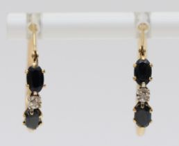 A 9ct gold pair of sapphire and diamond hoop ear rings, 1.2gm