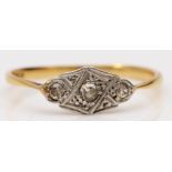 An Art Deco 18ct gold and platinum and diamond three stone ring, P 1/2, 1.4gm