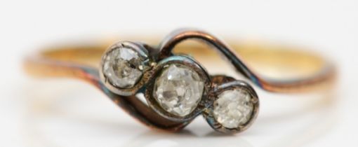 An antique 18ct gold and old cut diamond three stone ring, lacking date letter, K 1/2, 1.5gm