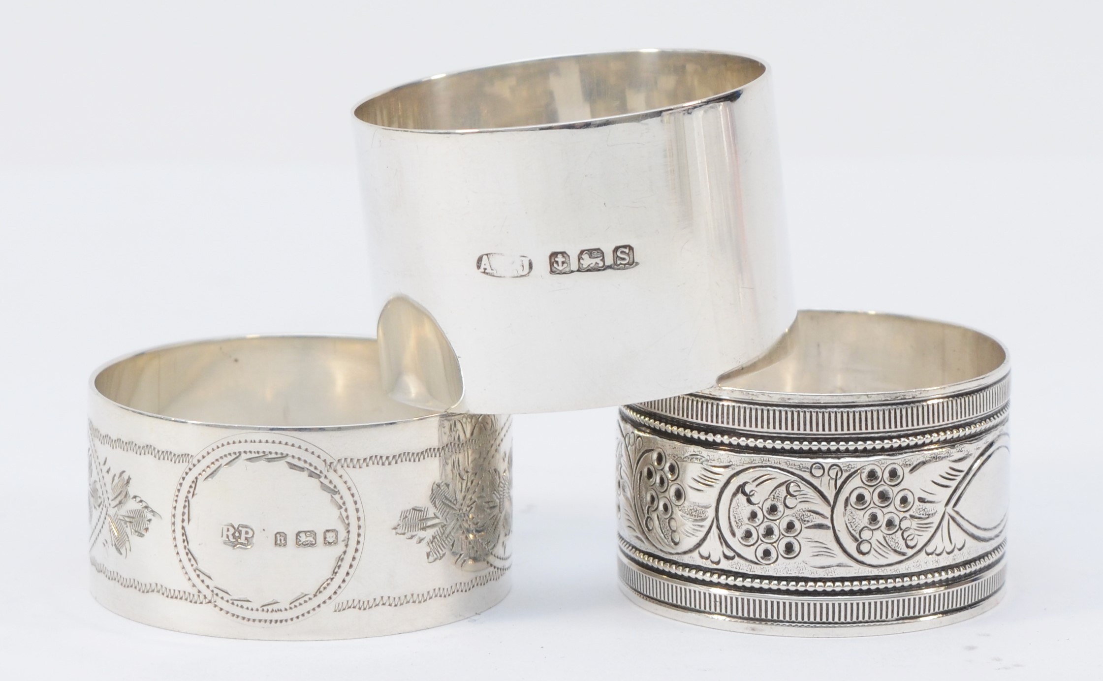 A silver napkin ring, by A.E. Jones, Birmingham 1917, inscribed Anne, and two other nakin rings, - Image 2 of 2