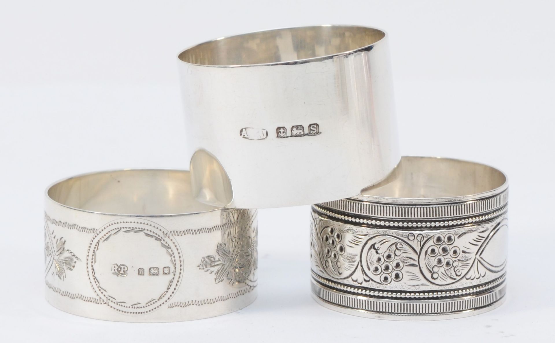 A silver napkin ring, by A.E. Jones, Birmingham 1917, inscribed Anne, and two other nakin rings, - Image 2 of 2