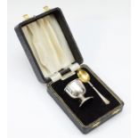 A silver egg cup and spoon, Birmingham 1973, loaded, case, not engraved
