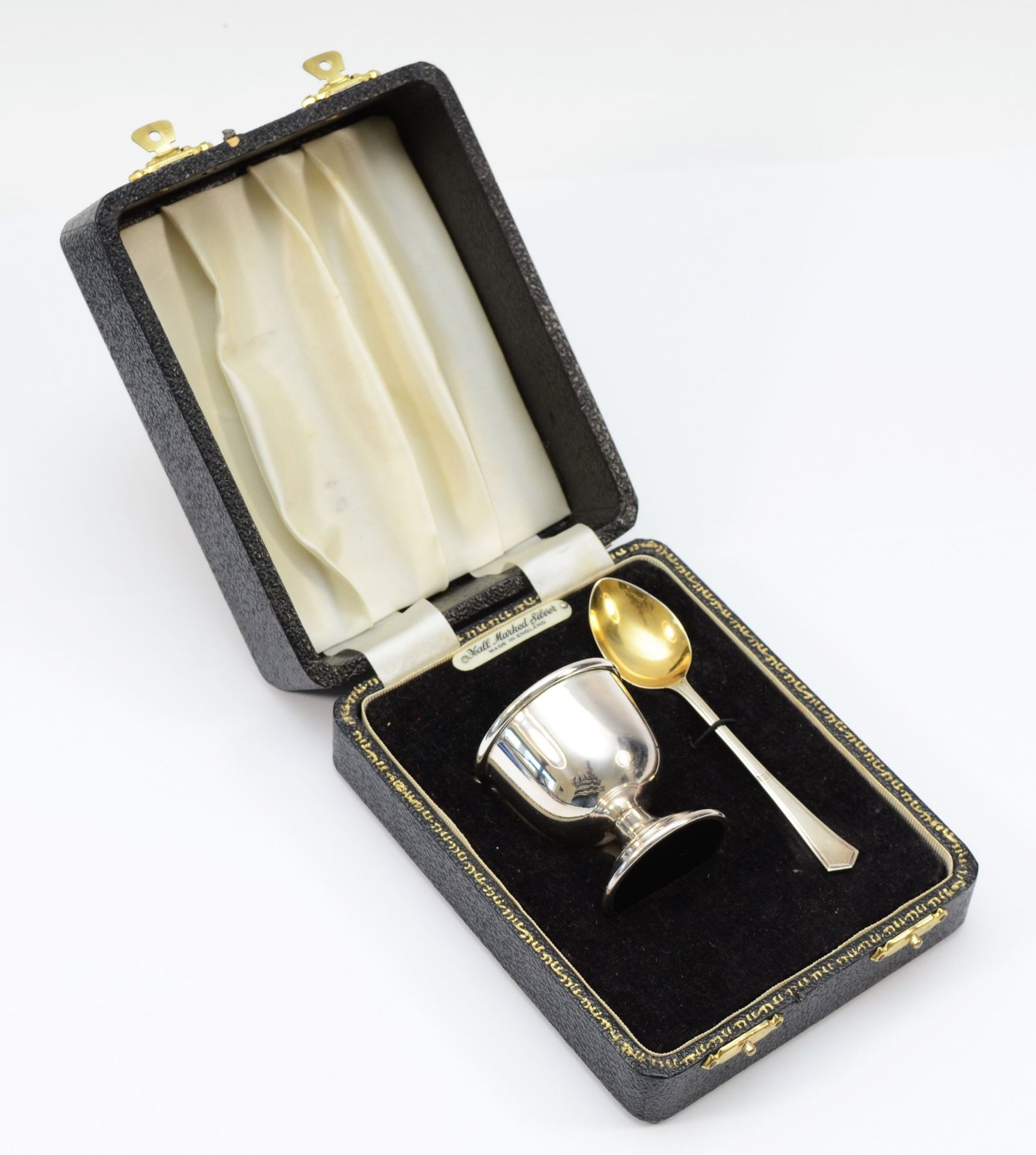 A silver egg cup and spoon, Birmingham 1973, loaded, case, not engraved