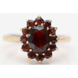 A 9ct gold and garnet cluster ring, L, 2.8gm