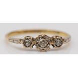 An 18ct gold and three stone diamond ring, M, 1.7gm