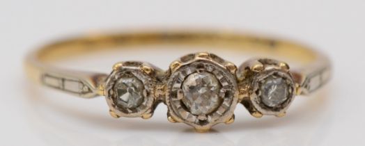 An 18ct gold and three stone diamond ring, M, 1.7gm