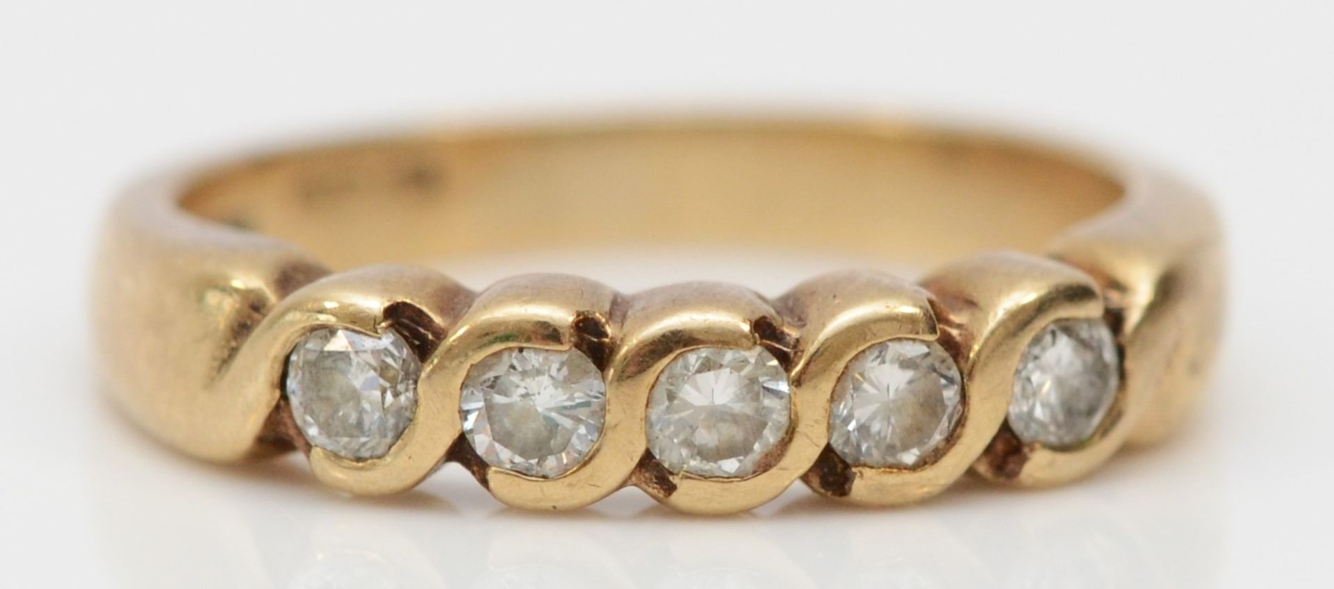 A 9ct gold and brilliant cut diamond five stone ring, I, 2.4gm