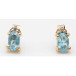 A 9ct gold, topaz and diamond pair of ear studs, 0.8gm