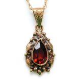 A Victorian style 9ct gold and garnet pear shape pendant 26mm overall, chain, 3gm