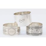 A silver napkin ring, by A.E. Jones, Birmingham 1917, inscribed Anne, and two other nakin rings,