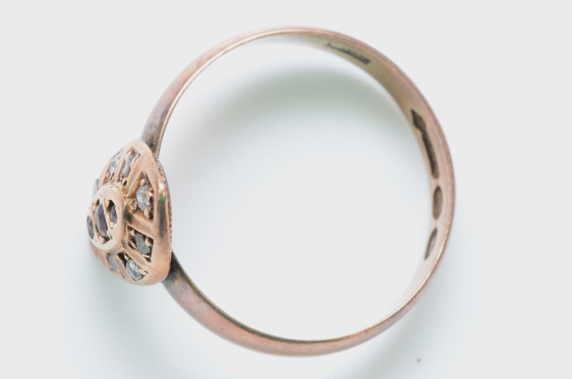 A 9ct rose gold red paste and diamond chip ring, London 1900, Q 1/2, 3.1gm, the shank appears to - Image 2 of 2