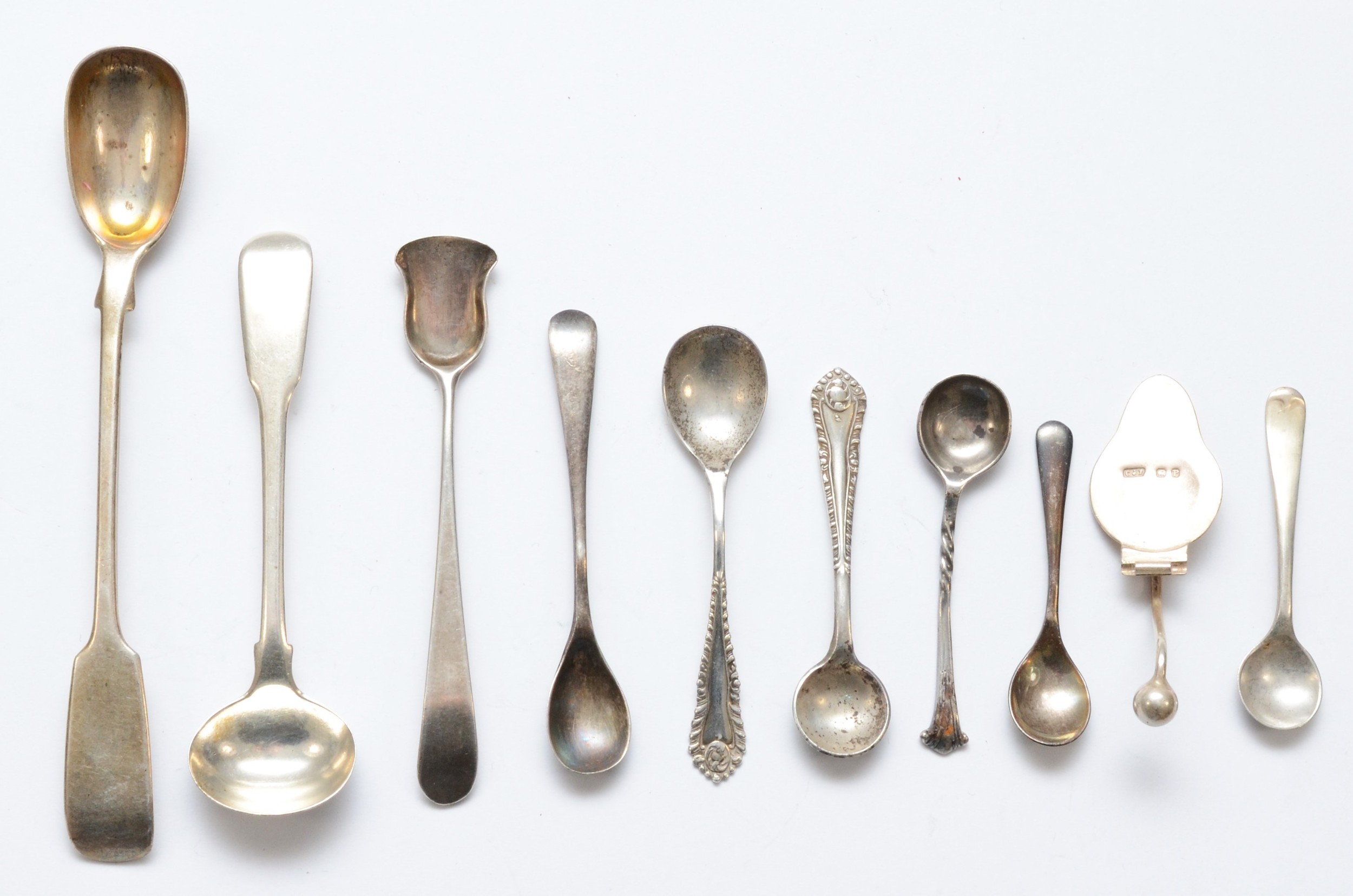 A collection of Georgian and later silver condiment spoons, 78gms