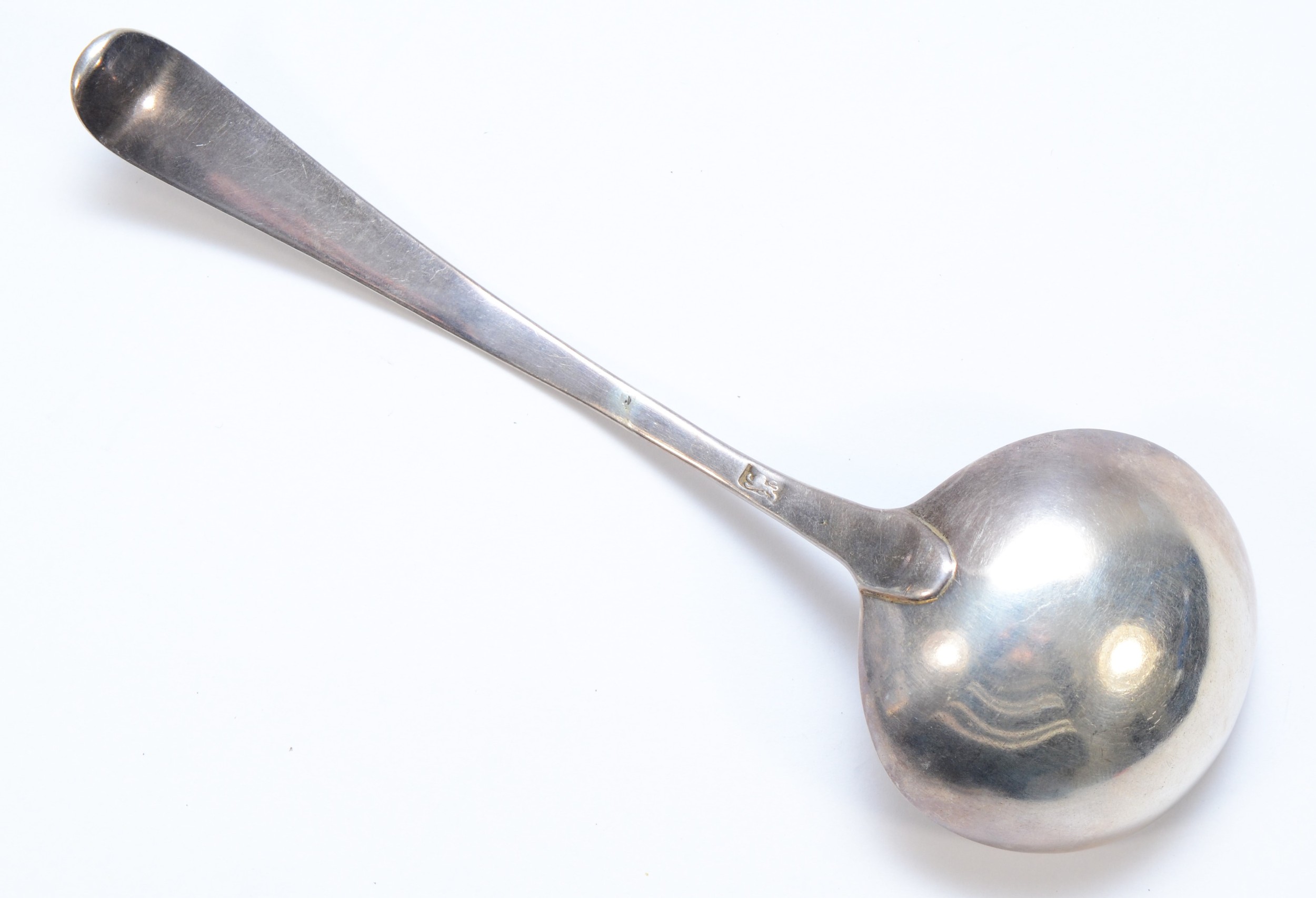 A George III silver bottom marked feather edge ladle, lion passant only, 17.5cm, 42gm - Image 2 of 2